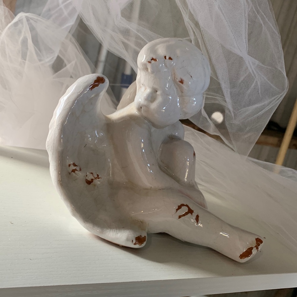 Cherub angel ceramic figure sitting